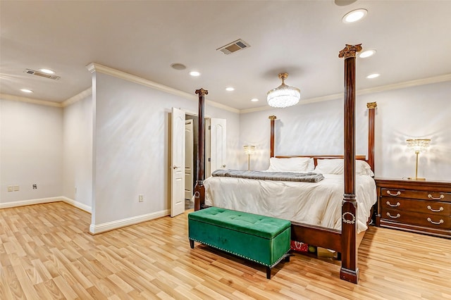 bedroom featuring crown molding, baseboards, visible vents, and light wood-type flooring