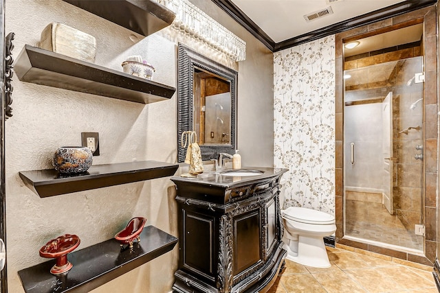 bathroom featuring visible vents, a stall shower, toilet, and ornamental molding