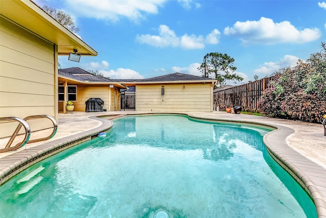 view of pool with a fenced in pool, a patio, and a fenced backyard