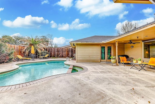 view of pool featuring ceiling fan, a fenced in pool, a patio, and a fenced backyard