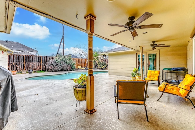 view of swimming pool featuring a patio, a ceiling fan, a fenced in pool, a fenced backyard, and outdoor lounge area