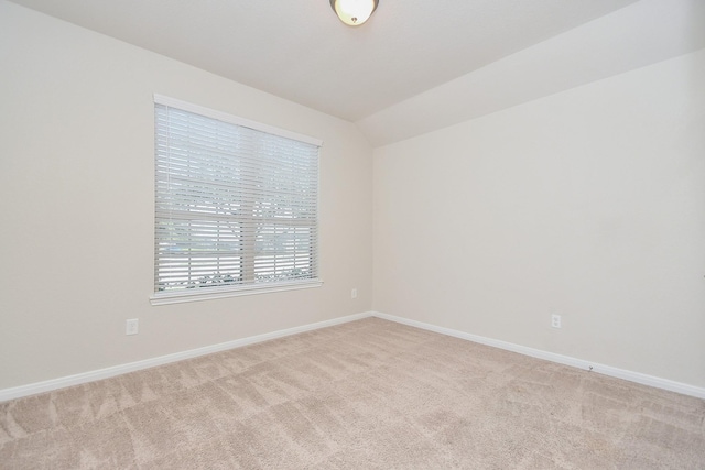 24703 Heirloom Ln, Katy, TX 77493 - empty room featuring light colored carpet and vaulted ceiling