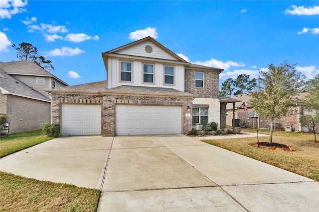 traditional-style house featuring a garage, concrete driveway, brick siding, and a front lawn