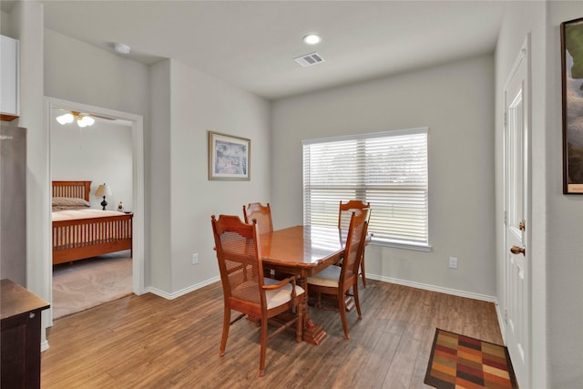 dining area with recessed lighting, visible vents, light wood-style flooring, and baseboards