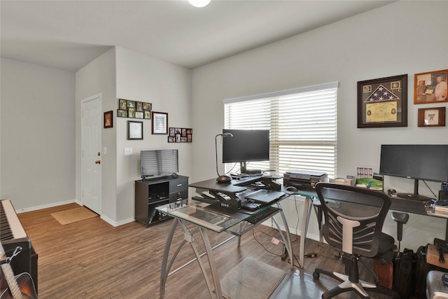 office space featuring wood finished floors and baseboards