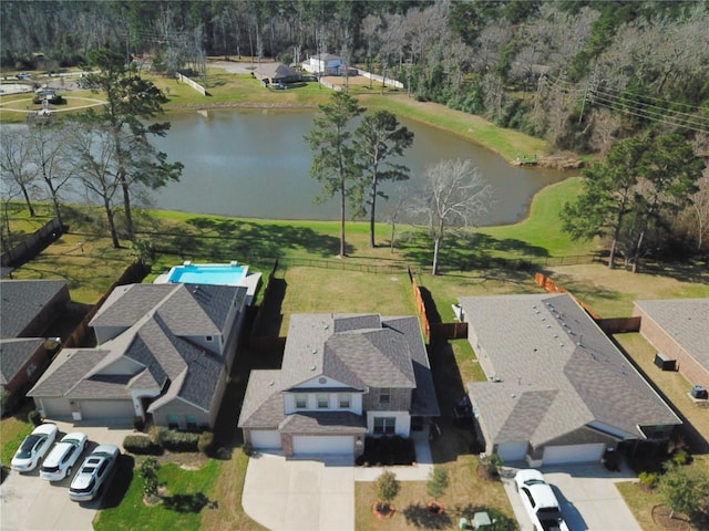 drone / aerial view with a water view and a residential view