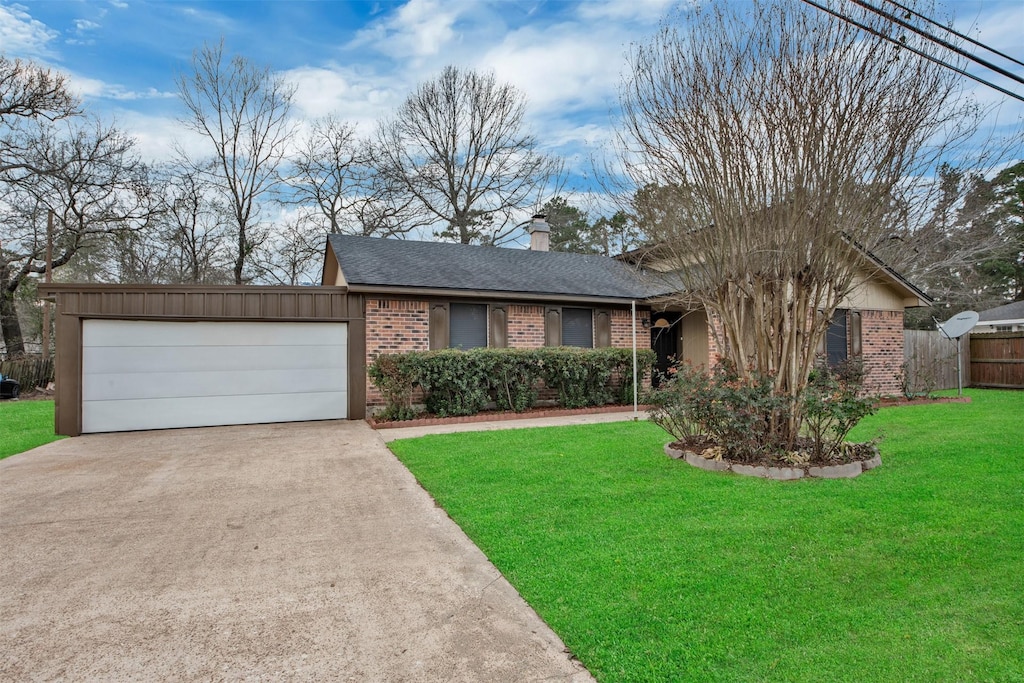 ranch-style house with brick siding, a chimney, concrete driveway, a garage, and a front lawn