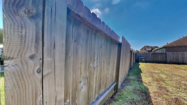 view of property exterior with a fenced backyard and a yard