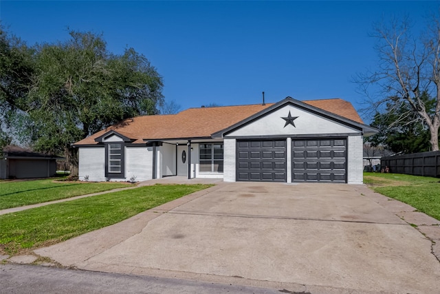 ranch-style house featuring an attached garage, concrete driveway, brick siding, and a front yard