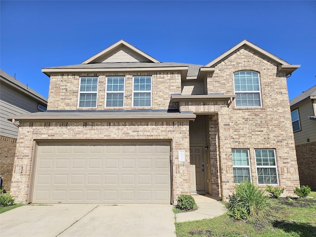 view of front of house with a garage, concrete driveway, and brick siding