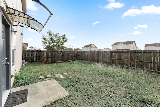 view of yard with a fenced backyard