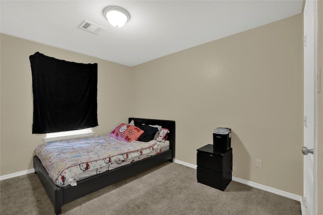 bedroom featuring carpet floors, visible vents, and baseboards