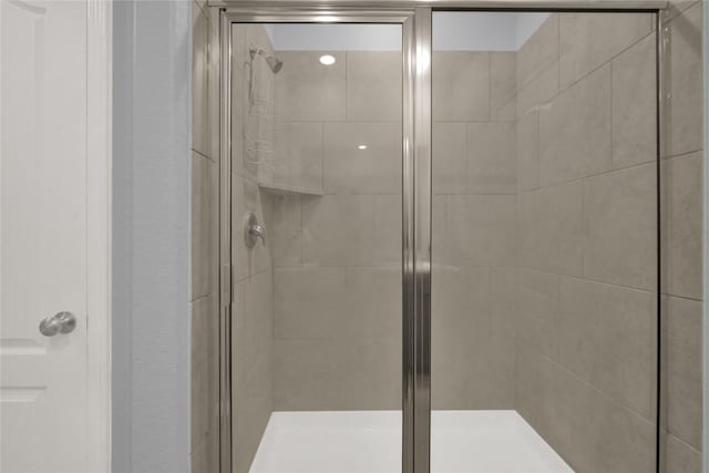 bathroom with a shower stall