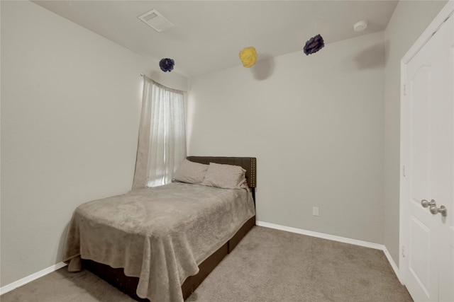 bedroom featuring carpet flooring, visible vents, and baseboards