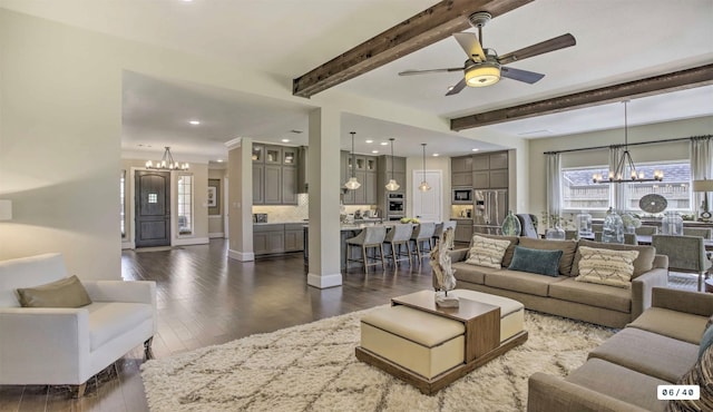 living area with baseboards, wood finished floors, ceiling fan with notable chandelier, beam ceiling, and recessed lighting