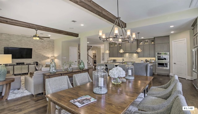 dining room with dark wood-style flooring, beamed ceiling, visible vents, and recessed lighting