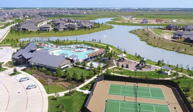 birds eye view of property featuring a water view and a residential view