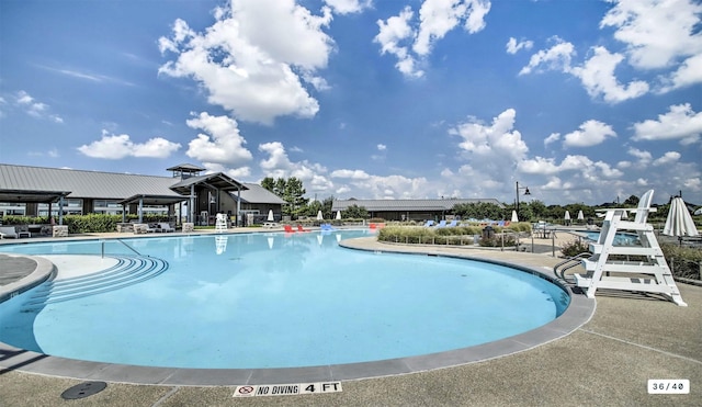 community pool featuring a patio