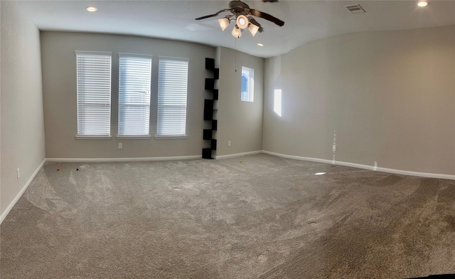 spare room featuring recessed lighting, visible vents, carpet flooring, and baseboards