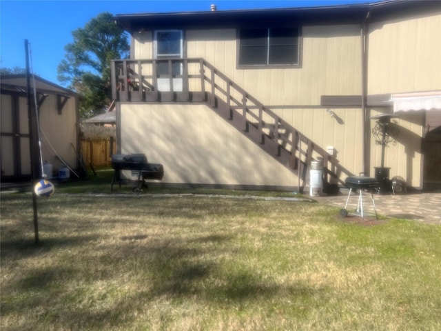 8111 Ivan Reid Dr, Houston, TX 77040 - rear view of house with stairs and a lawn