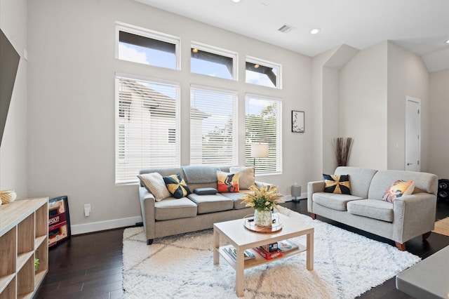 living room featuring recessed lighting, visible vents, baseboards, and dark wood-type flooring