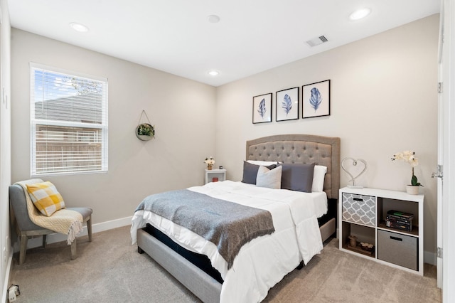 bedroom with recessed lighting, visible vents, baseboards, and light colored carpet