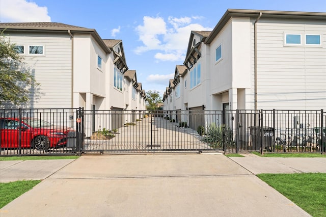 view of road with a gate and a residential view