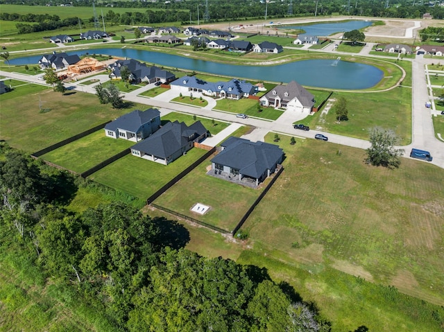 drone / aerial view with a residential view and a water view