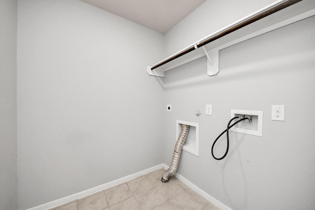 clothes washing area with hookup for a washing machine, hookup for a gas dryer, hookup for an electric dryer, laundry area, and baseboards