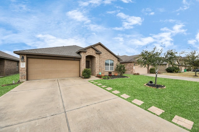 view of front of home with brick siding, roof with shingles, an attached garage, driveway, and a front lawn