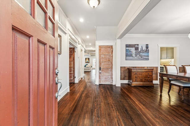 entryway with baseboards, ornamental molding, dark wood finished floors, and recessed lighting