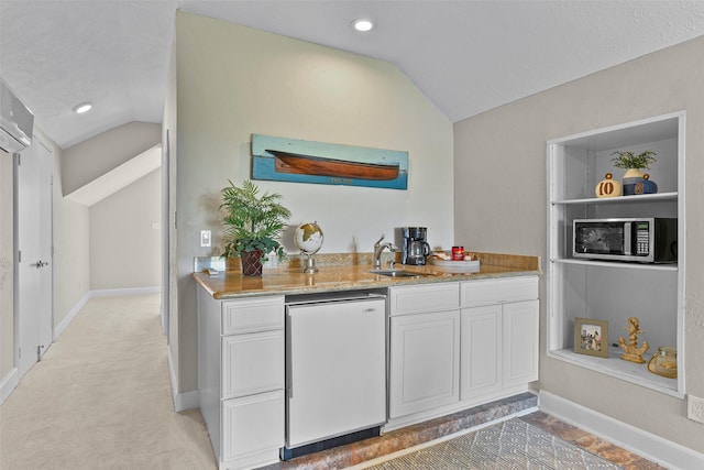 bar featuring vaulted ceiling, dishwashing machine, stainless steel microwave, and a sink