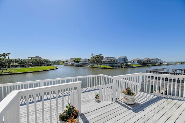 deck featuring a water view and a residential view