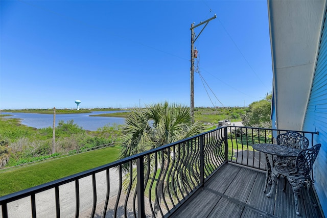 balcony featuring a water view