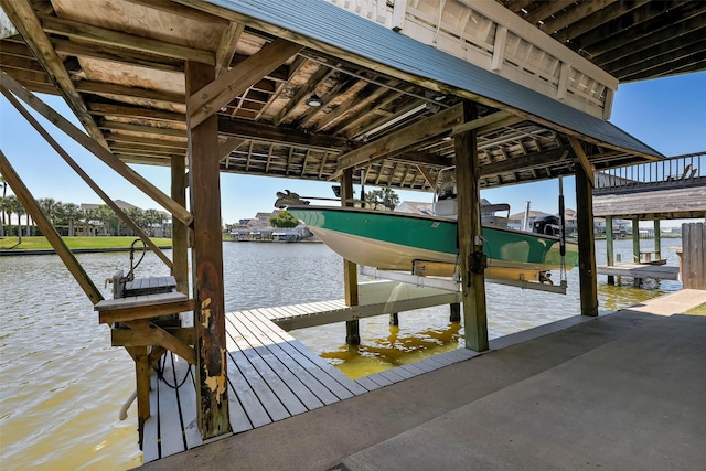 dock area featuring a water view and boat lift