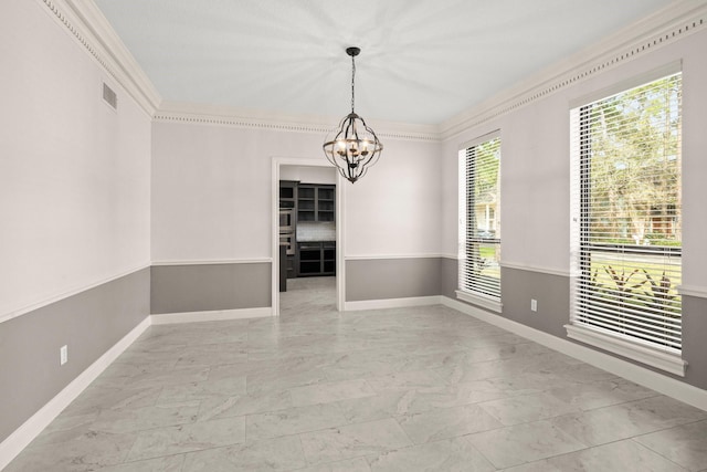 unfurnished dining area with visible vents, marble finish floor, crown molding, baseboards, and a chandelier