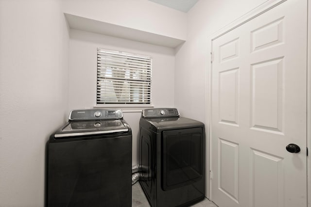 washroom featuring washer and clothes dryer and laundry area