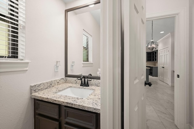 bathroom featuring vanity and crown molding