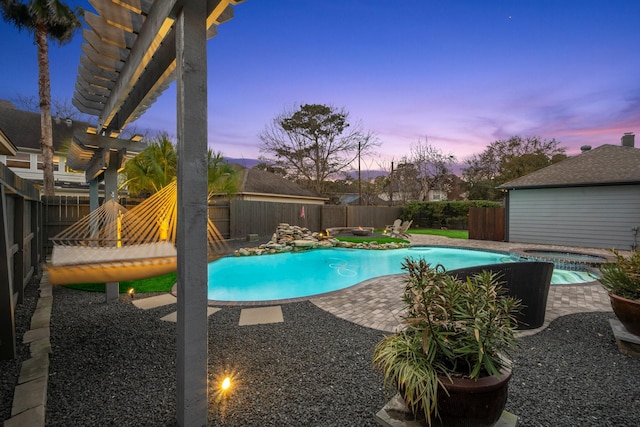 view of pool featuring a fenced in pool, a patio, an in ground hot tub, and a fenced backyard