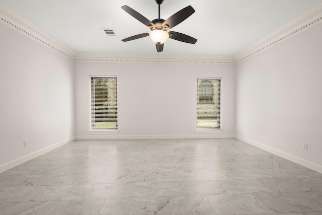 spare room with visible vents, crown molding, baseboards, ceiling fan, and marble finish floor