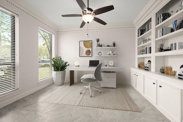 office area with a ceiling fan, baseboards, and ornamental molding