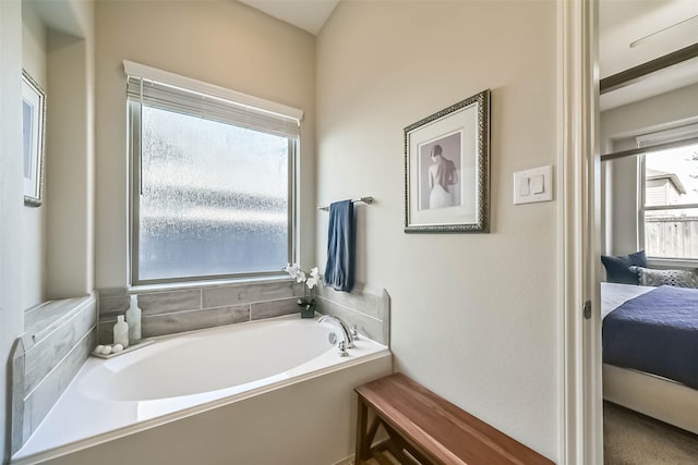 full bathroom featuring a garden tub and connected bathroom