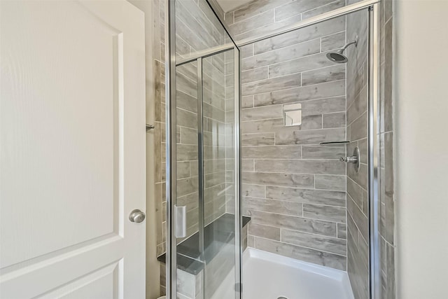 full bathroom featuring a shower stall