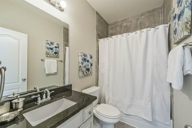 bathroom featuring vanity, toilet, and shower / tub combo with curtain