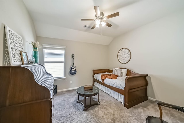 carpeted bedroom featuring vaulted ceiling, visible vents, a ceiling fan, and baseboards