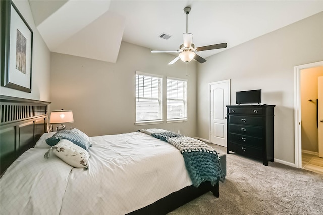 bedroom featuring visible vents, a ceiling fan, light carpet, vaulted ceiling, and baseboards