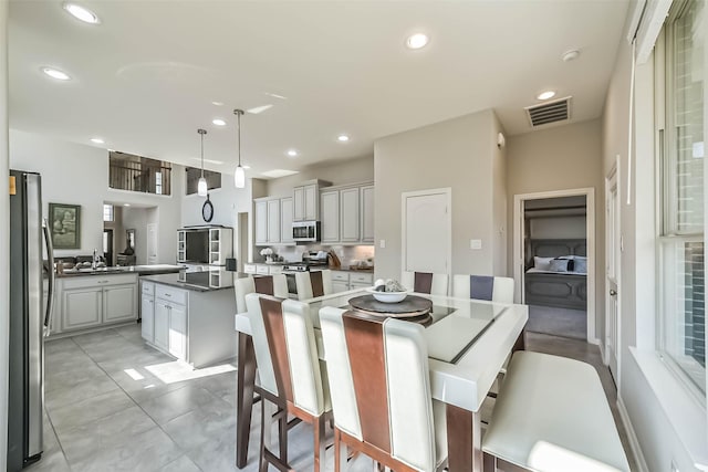 dining space featuring visible vents and recessed lighting