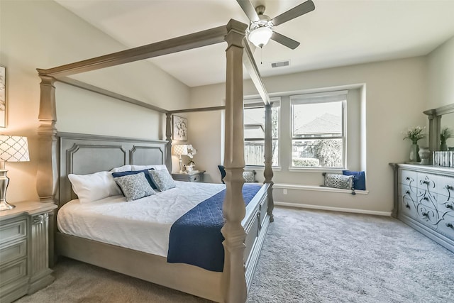 bedroom with carpet floors, baseboards, visible vents, and a ceiling fan