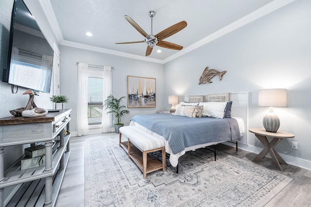 636 Villa Dr, Crystal Beach, TX 77650 - bedroom featuring crown molding, recessed lighting, a ceiling fan, wood finished floors, and baseboards