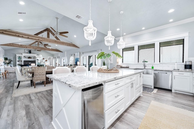 636 Villa Dr, Crystal Beach, TX 77650 - kitchen with vaulted ceiling with beams, a kitchen island, white cabinetry, visible vents, and dishwasher